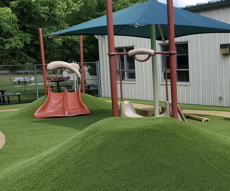 mounds at a plaground with grass
