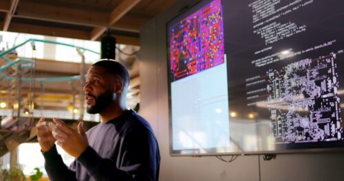 A person giving a presentation at a conference