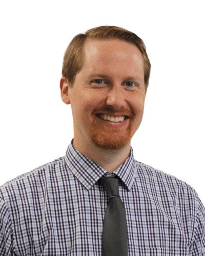Head shot of Dan Gilbert, tie and checked shirt, short ginger hair and beard