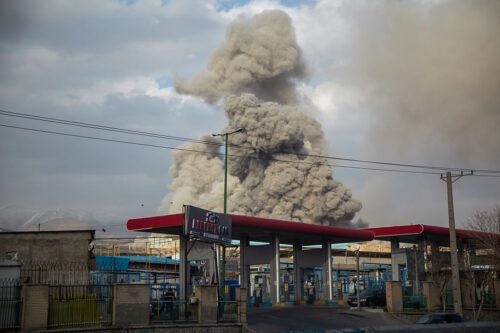 A plume of smoke rises after an explosion