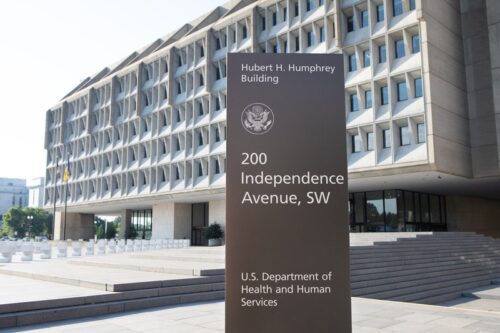 The outside, front view of the U.S. Health and Human Services building and sign.