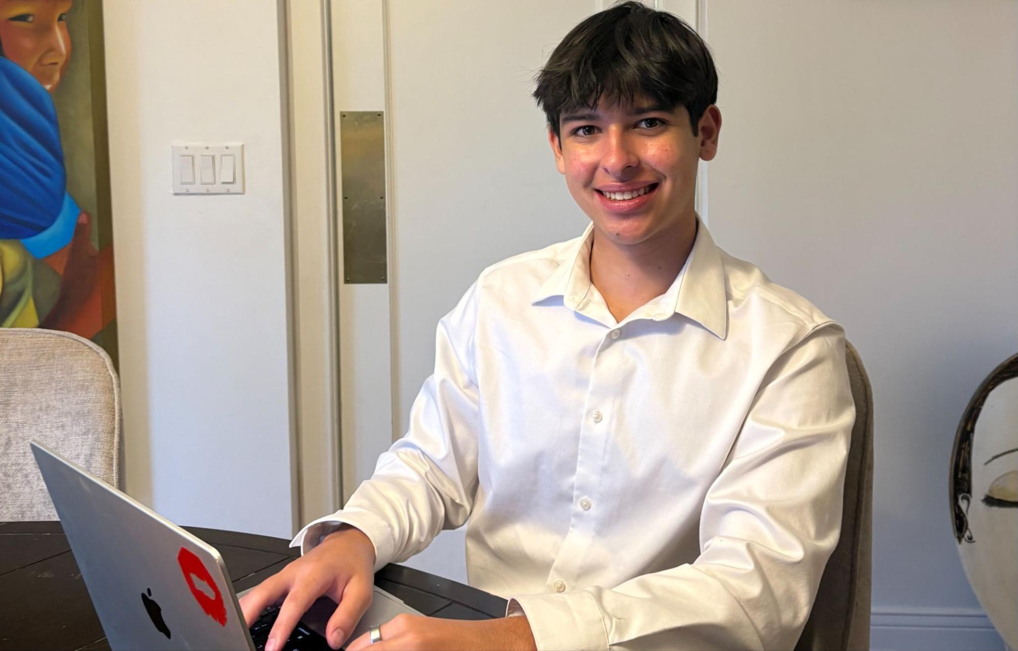Emilio Saenz sitting at a computer