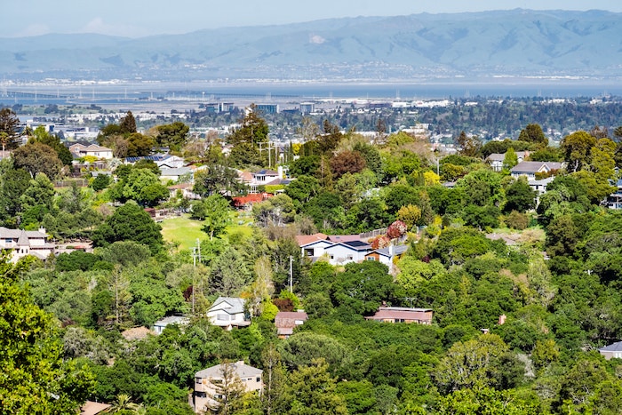 Aerial view of Redwood City, CA, with the San Francisco Bay in the background