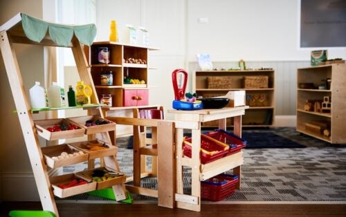 an empty preschool classroom with shelves