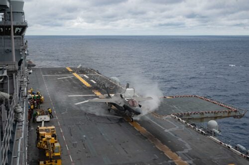 An F-35B Lightning II fighter aircraft from Marine Fighter Attack Squadron (VMFA) 242, takes off from the flight deck of the amphibious assault ship USS America