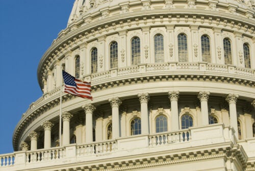 U.S. Capitol Dome with flying U.S. flag
