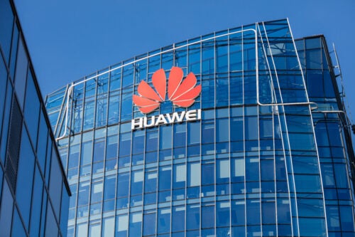 Image of a skyscraper with the Huawei logo.