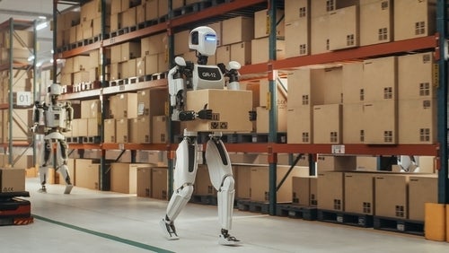robot carrying a box in a warehouse