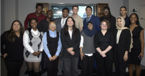 Picture of fifteen young people dressed in business casual attire.