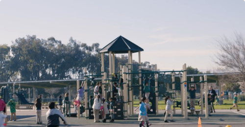 A preschool playground with young children playing on it in California.