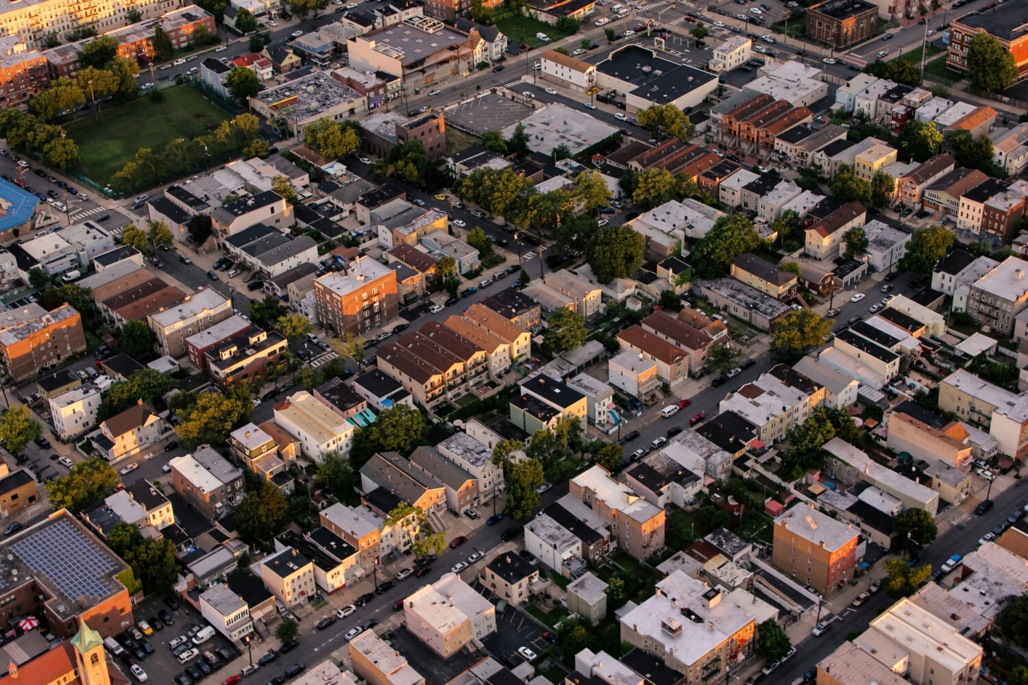 Aerial image of an urban neighborhood with multifamily housing.