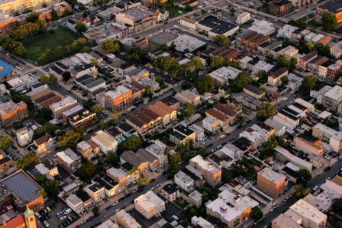 Aerial image of an urban neighborhood with multifamily housing.